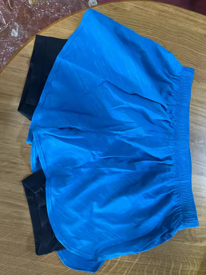 Color is exactly like the photos. The 2-in-1 is legit, you don’t need anything underneath. Soft fabric too.